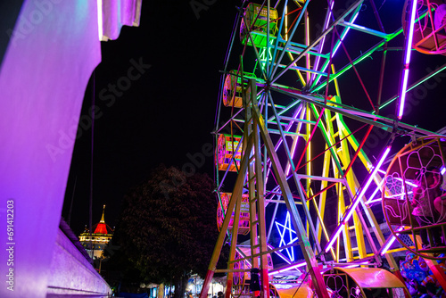 Ferris wheel near temple of the Golden Mount Bangkok Wat Saket Ratchaworamahawihan photo