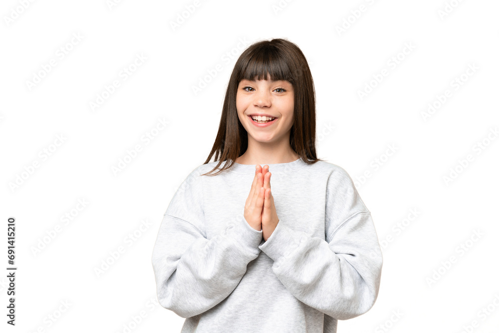 Little girl over isolated green chroma key background keeps palm together. Person asks for something Little girl over isolated green chroma key background keeps palm together. Person asks for something