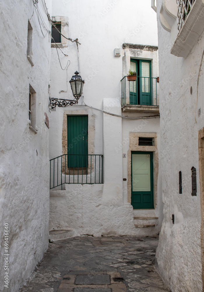 Fototapeta premium Ostuni, Italy - one of the most beautiful villages in South Italy, Ostuni displays a wonderful Old Town with narrow streets and alleys 