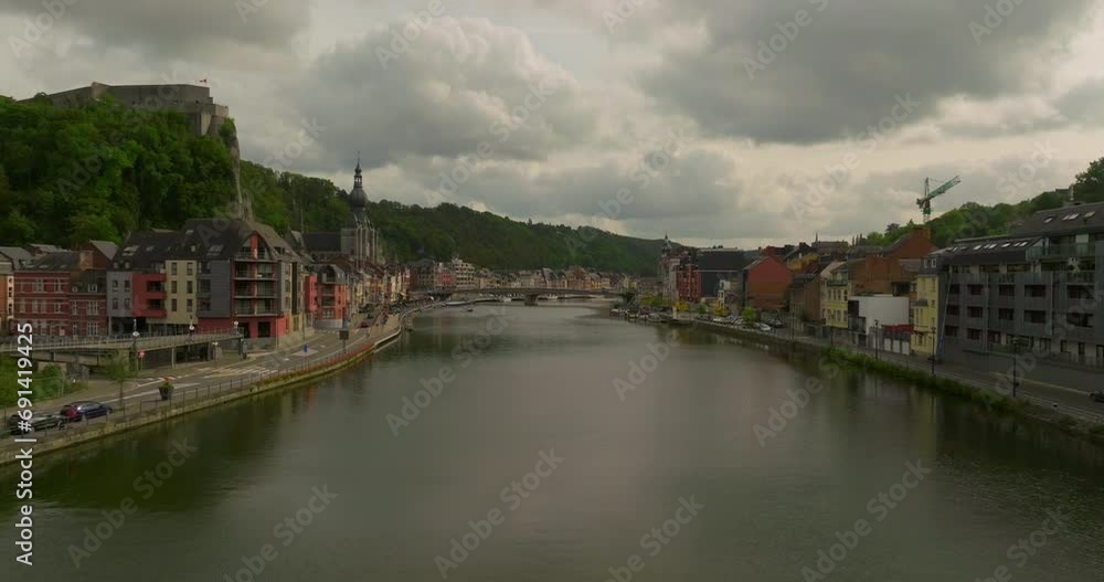 Flying a drone along a river in the picturesque town of Dinant. City of Saxophones, Belgium Flying a drone along a river in the picturesque town of Dinant. City of Saxophones, Belgium