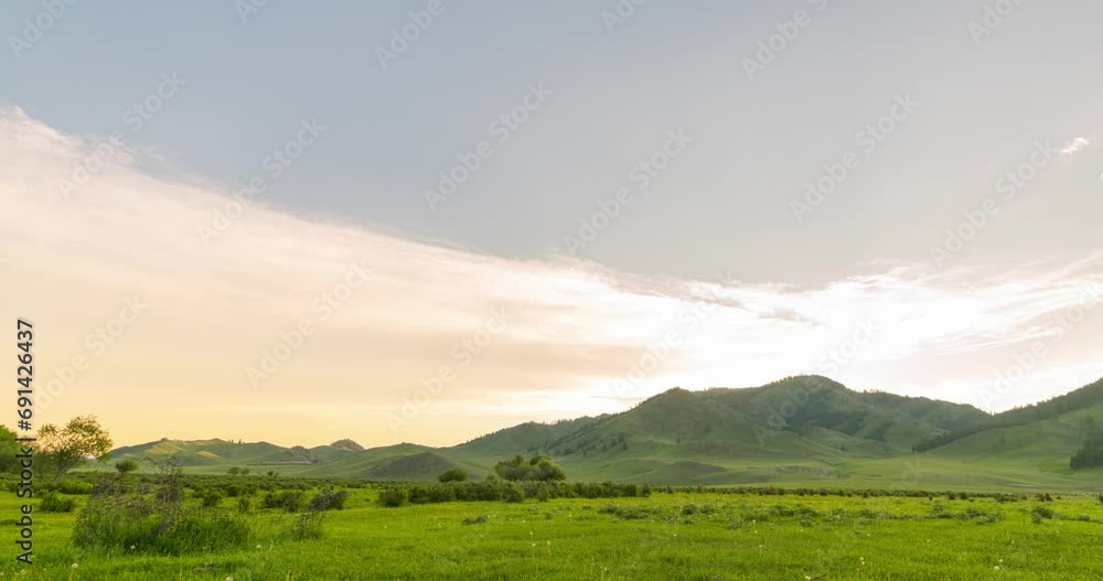 Mountain meadow time-lapse at the summer or autumn sunrise. Wild nature and rural field. Clouds movement, green grass and sun rays. Motorised panorama Mountain meadow time-lapse at the summer or autumn sunrise. Wild nature and rural field. Clouds movement, green grass and sun rays. Motorised panorama