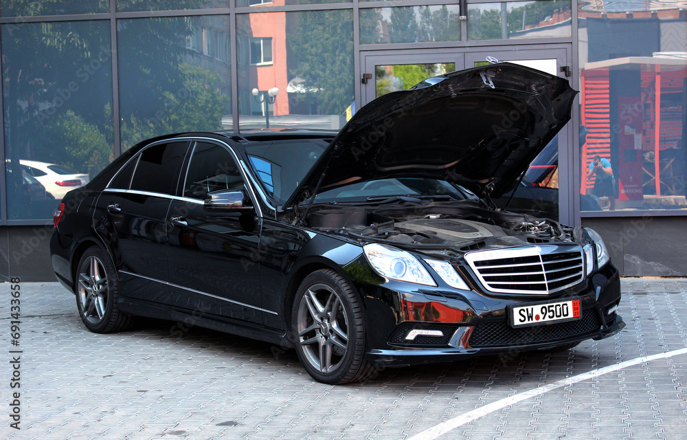 Vinnytsia, Ukraine; June 20, 2023. Black Mercedes-Benz E350 AMG open