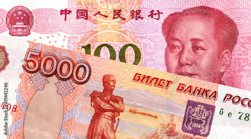 Photography Russian roubles and Chinese yuan banknote with Mao Zedong portrait