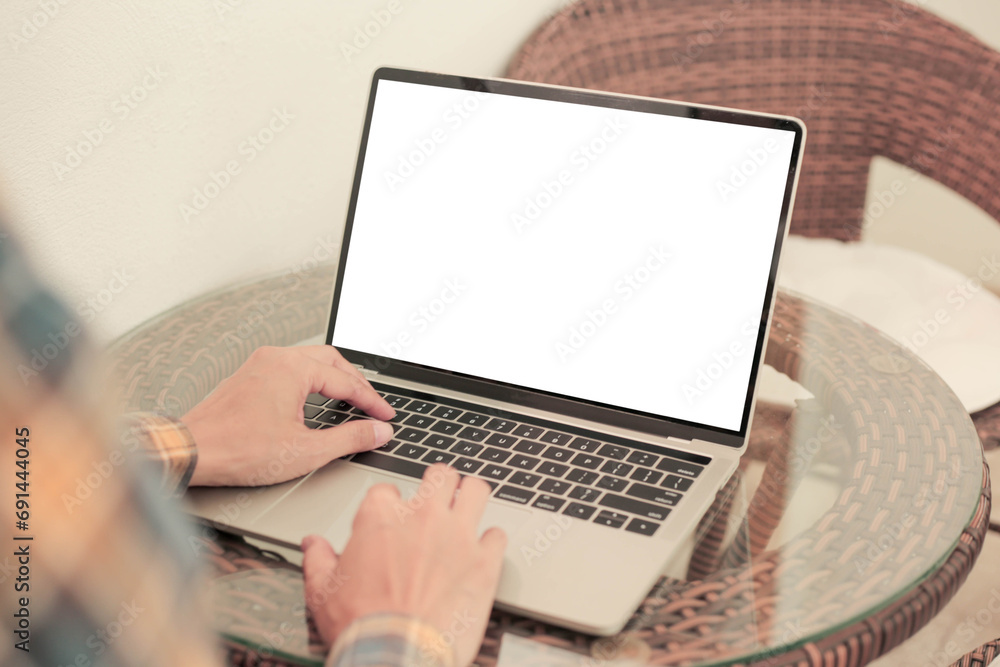 computer screen blank mockup.hand woman work using laptop with white background for advertising,contact business search information on desk at coffee shop.marketing and creative design computer screen blank mockup.hand woman work using laptop with white background for advertising,contact business search information on desk at coffee shop.marketing and creative design