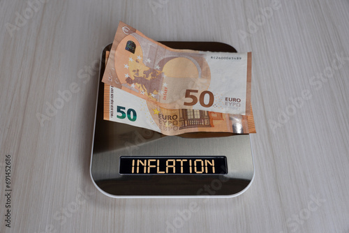 Wallpaper Mural euro bills on electronic scales, a symbol of cost reduction, inflation, depreciation of money. concept of inflation in the European Union Torontodigital.ca