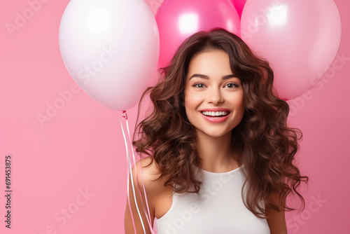 Young pretty brunette girl over isolated colorful background holding balloons