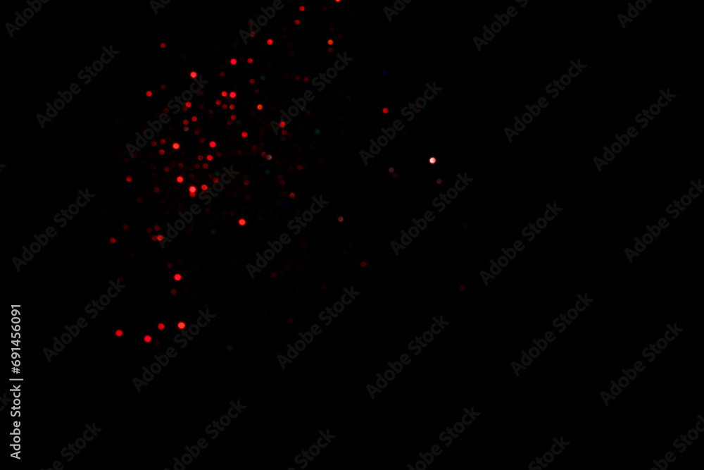 Red blurred bokeh lights on black background. Glitter sparkle confetti for celebrate. Overlay for your design Red blurred bokeh lights on black background. Glitter sparkle confetti for celebrate. Overlay for your design