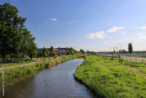 Pastures with farms and roads in the future Fifth Village of the Zuidplaspolder of the municipality of Zuidplas photo