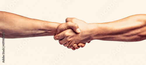 Partners who shake their hands. Friendly handshake, friends greeting, teamwork, friendship. Rescue, helping gesture or hands. Two hands, helping hand of a friend. Handshake, arms friendship photo