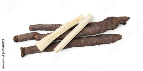 Cut raw salsify roots isolated on white, top view photo