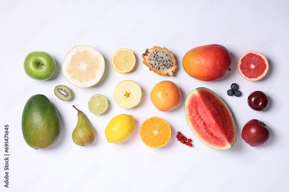 Different ripe fruits and berries on white background, top view Different ripe fruits and berries on white background, top view