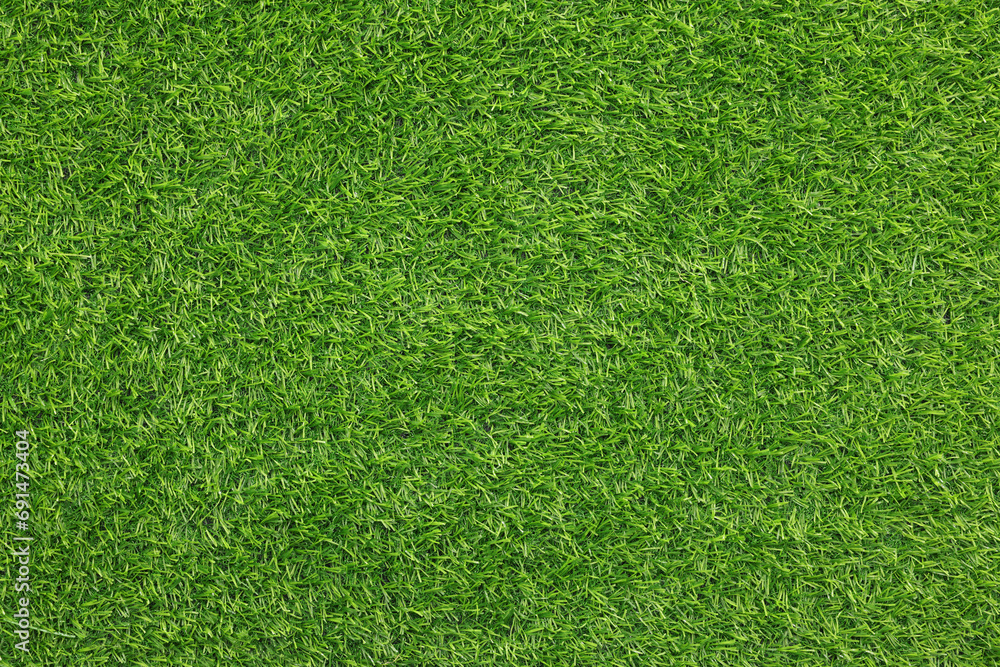 Obraz premium Green artificial grass as background, top view