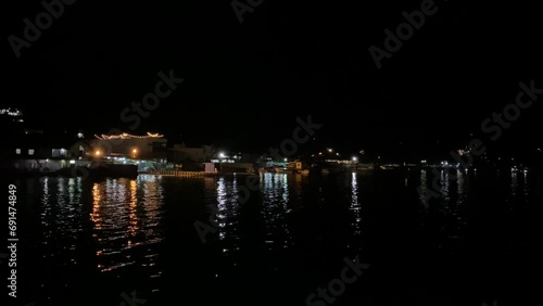 Lake Toba of North Sumatra view from ferry ship at night. photo