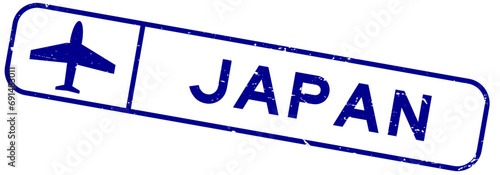 Grunge blue japan word with plane icon square rubber seal stamp on white background