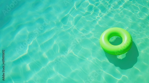 Green lifebuoy in the pool