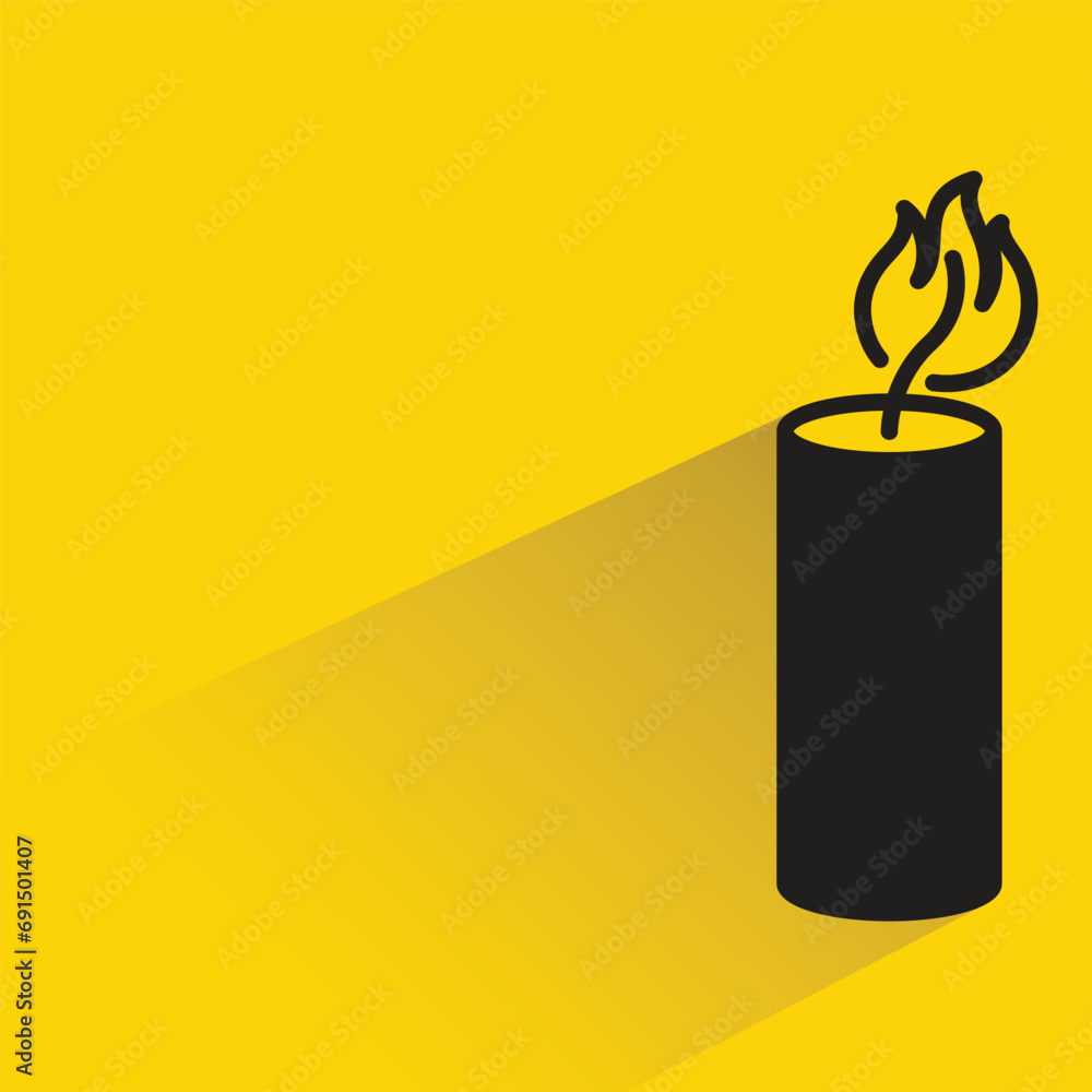 candle with shadow on yellow background candle with shadow on yellow background