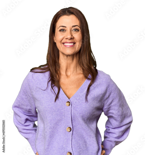 Elegant middle-aged Caucasian woman in studio setting happy, smiling and cheerful.