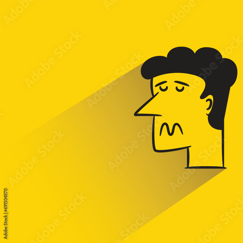 bored face with shadow on yellow background