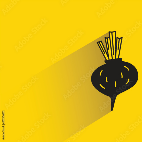 beetroot with shadow on yellow background