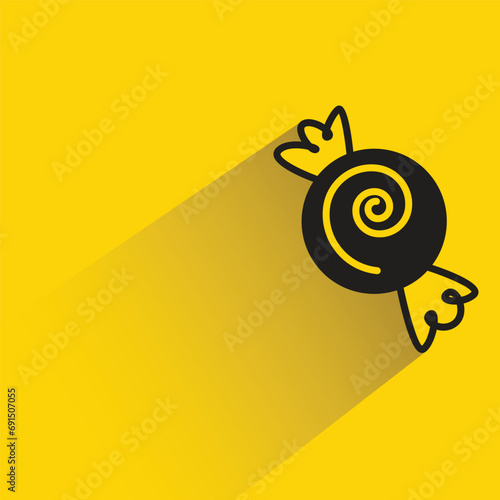 taffy candy with shadow on yellow background