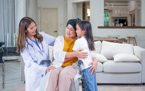 Beautiful Asian female doctor and granddaughter giving encouragement and hugging grandmother who get sick or cancer, smiling with happiness, love, warmth. Retirement, Healthcare, Insurance Concept.