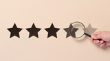 Five star rating and a magnifying glass in a woman's hand. Customer reviews