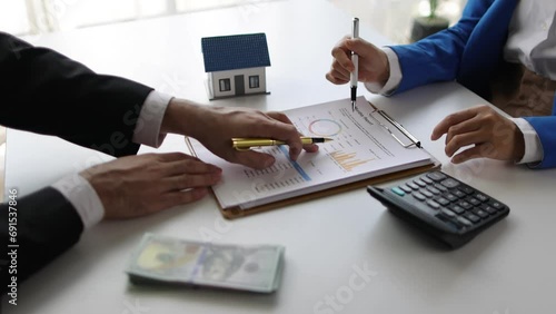 Real estate agent home offering and down payment and installment schedule. Discuss analysis growth charts of the real estate business, cash flow, income, expenses, and profit and loss of the property. photo