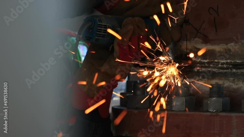 Sparks fly from a working grinder