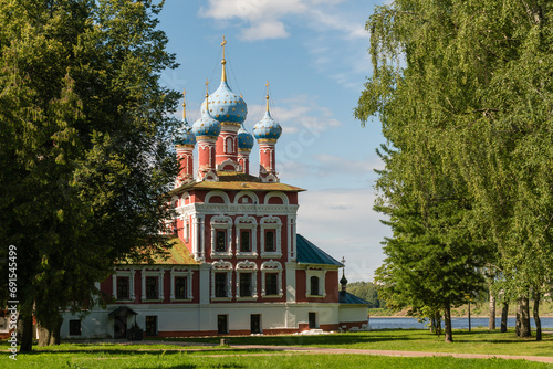 Uglich, Russia, July 9, 2023. Temple of Demetrius on the Blood among the trees of the park. photo