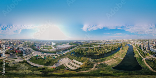 Beautiful sunset panoramic aerial drone view to panorama of Warsaw modern City with skyscraper and The PGE Narodowy National Stadium 360