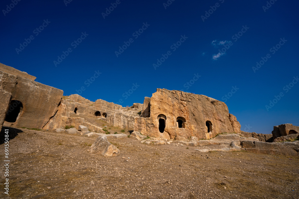 Ruins of rock cut building in Dara ancient city. Mardin, Turkey.