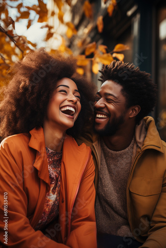 Joyful African American Couple in Their 30s Sharing Laughs While Chatting Outdoors