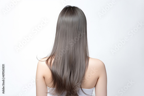 The young lady's back, her long silver hair flowing smoothly against the white studio background, showcasing her elegant and chic style. Generative AI.