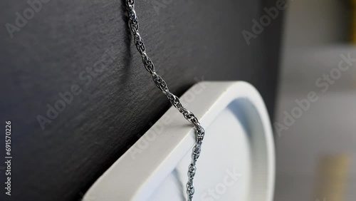 Unusual weaving of silver chain, jewelry photo