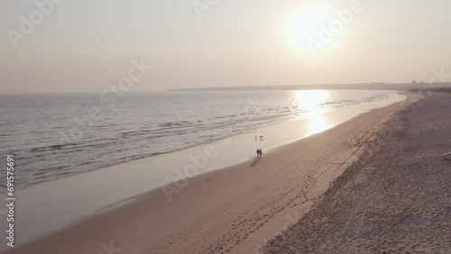 Aerial panoramic sunset seascape view of Salgados beach in Albufeira, at Algarve region, a Worldwide Popular Beach and Nature Destination, in South Portugal.