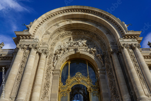 The main entrance of a grand building in Paris