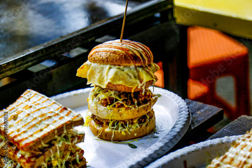 delicious Chicken Sandwich and Burger Making by Chef. Street Food in Colombo. photo