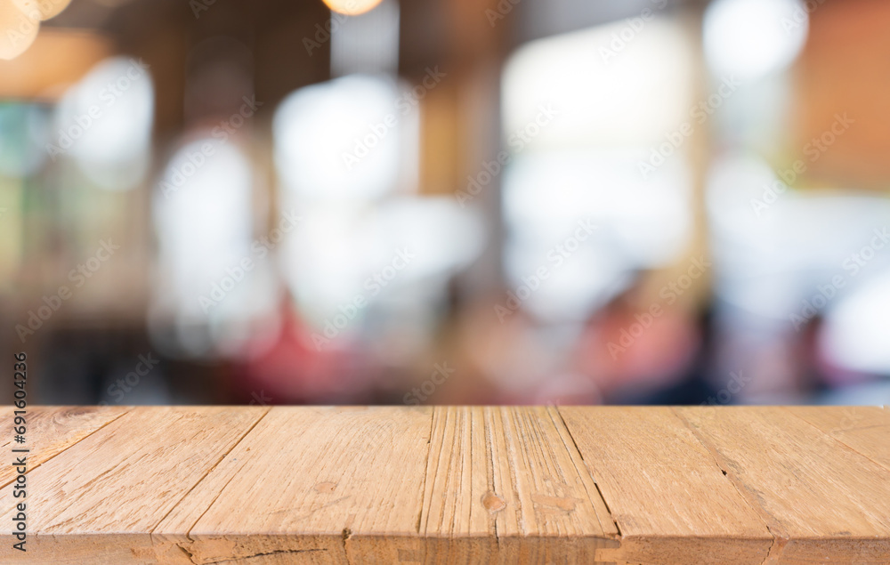 Mock up for space. Empty dark wooden table in front of abstract blurred bokeh background of restaurant . can be used for display or montage your product Mock up for space. Empty dark wooden table in front of abstract blurred bokeh background of restaurant . can be used for display or montage your product