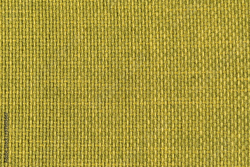 A green woven fabric texture. The image is a full frame of the fabric with a slight variation in the color and texture.