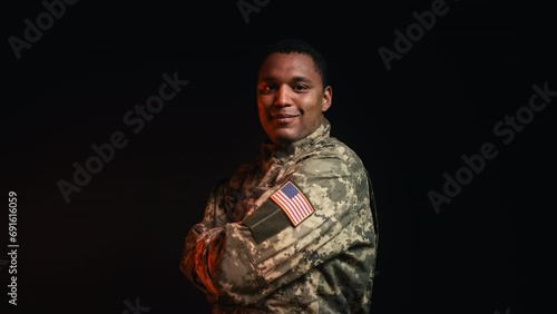 Portrait of professional U.S. army military man in uniform on black background photo