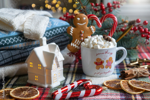 A cup of hot, aromatic cocoa with marshmallows, a calendar for 2024, a New Year's mood.