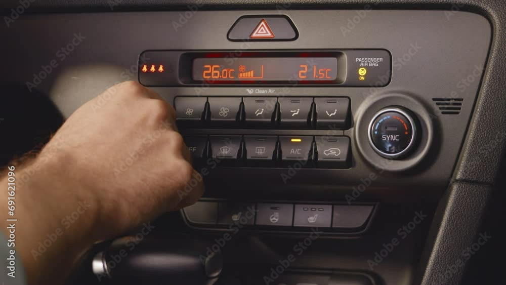 Auto mode. Man's hand using air control panel, rolling button. Turning on the heating mode in the car. Adjusting car air conditioning. High quality 4k footage Auto mode. Man's hand using air control panel, rolling button. Turning on the heating mode in the car. Adjusting car air conditioning. High quality 4k footage