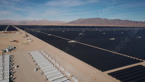 White battery power storage array battery units at a large solar power plant in the desert photo