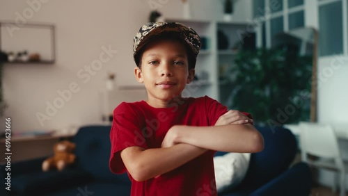 Portrait of smiling little boy in a military cap, dreaming of becoming a soldier photo