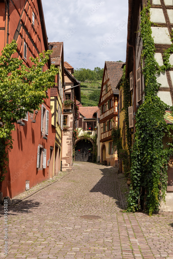 Half-timbered houses in a typical side street of Kaysersberg in Alsace, France