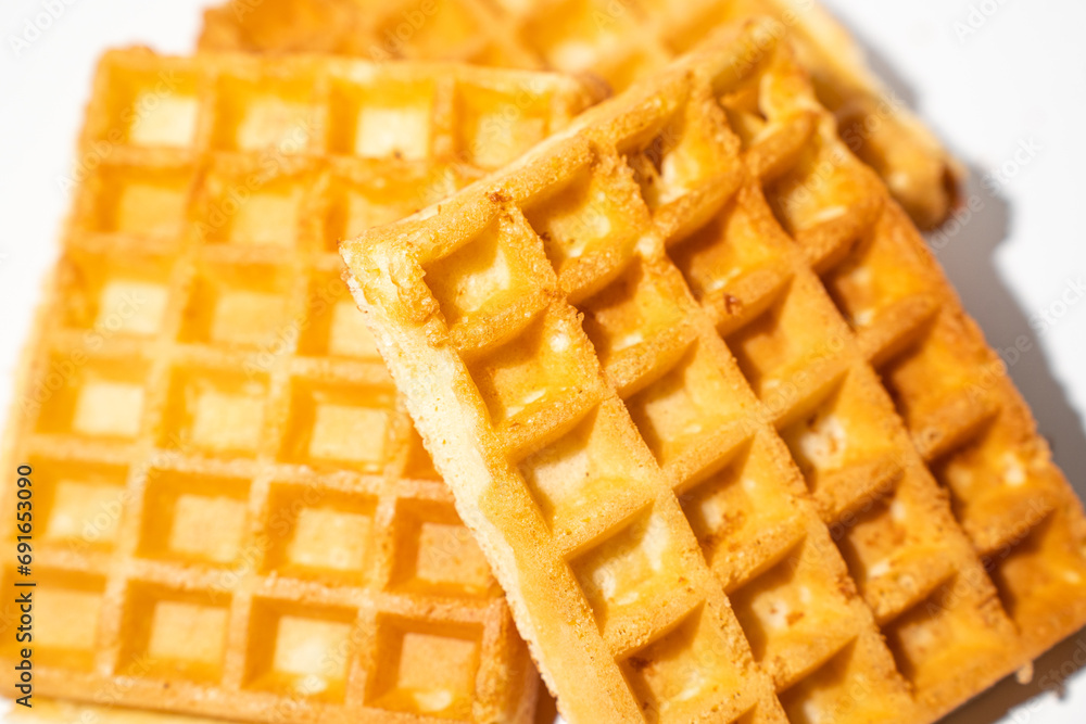 freshly baked Belgian waffles are piled up freshly baked Belgian waffles are piled up