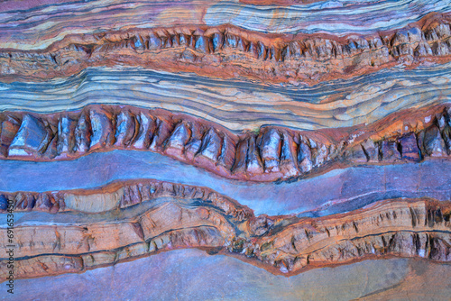 Colorful sedimentary rock layers in natural patterns