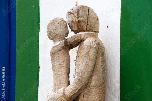 Wooden sculpture representing mother and child
