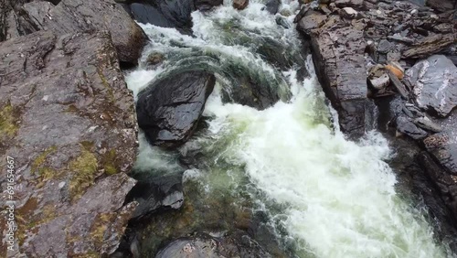 Close Up of Small Rapid River and Wet Rocks in Voss - Norway 2.7K Aerial