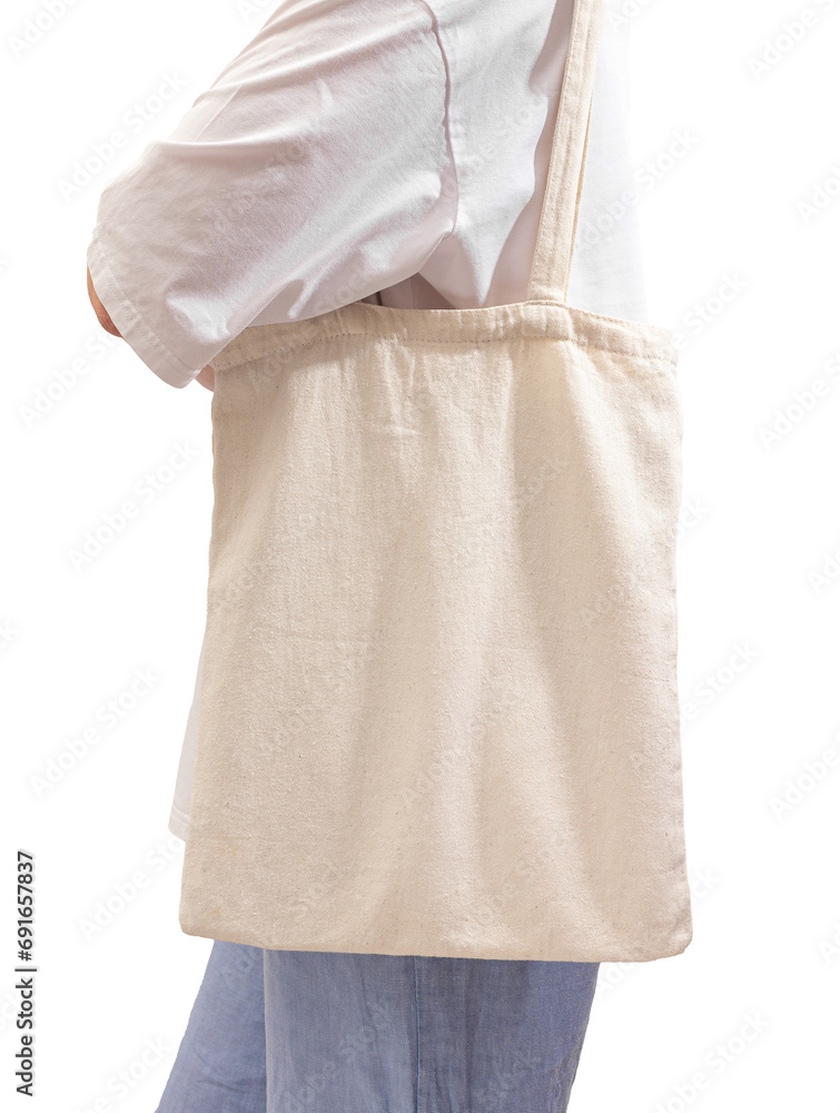 Carrying modern eco tote bag on shoulder. Woman with shopper isolated on white background Carrying modern eco tote bag on shoulder. Woman with shopper isolated on white background
